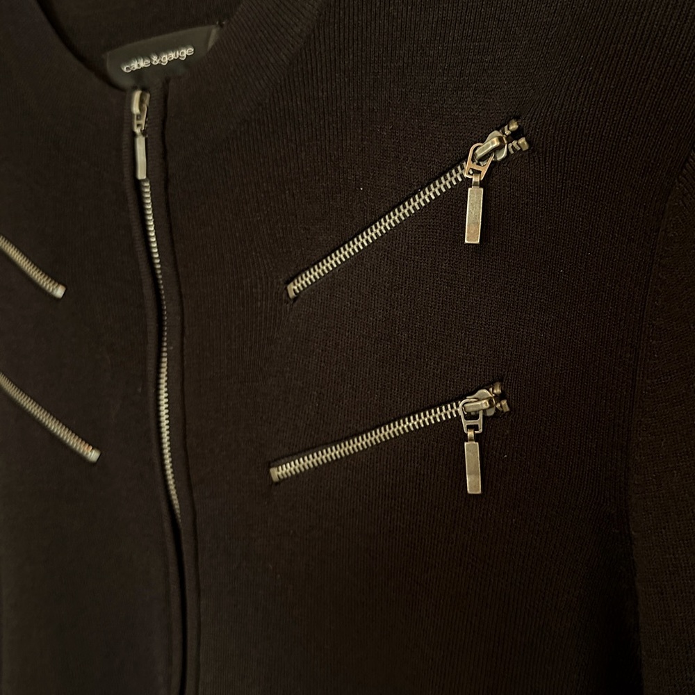 Tailored thin over-sweater with 7 working zippers. Modern sleek dress sweater.